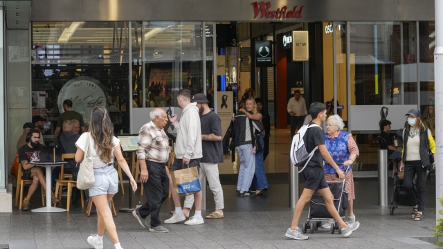 People walk outside the Westfield shopping mall at Bondi Junction in Sydney