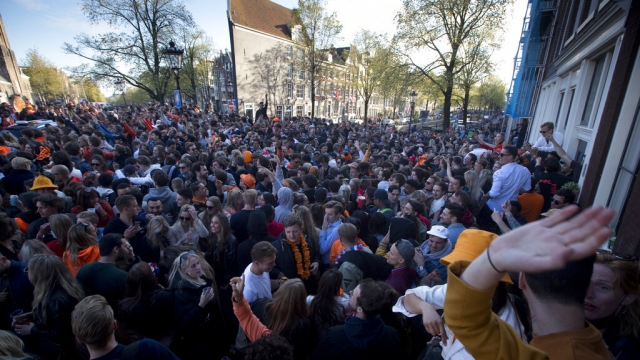 People celebrate King's Day in the center of Amsterdam