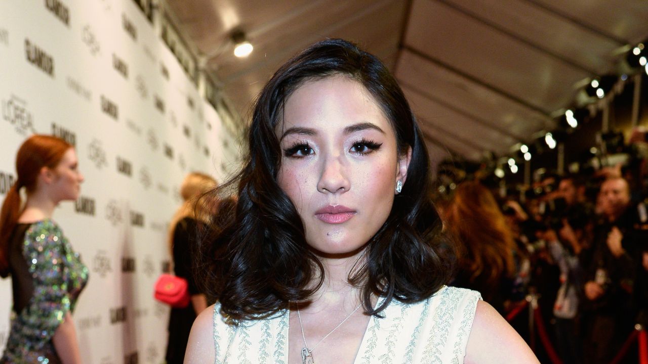 Constance Wu poses on the red carpet.
