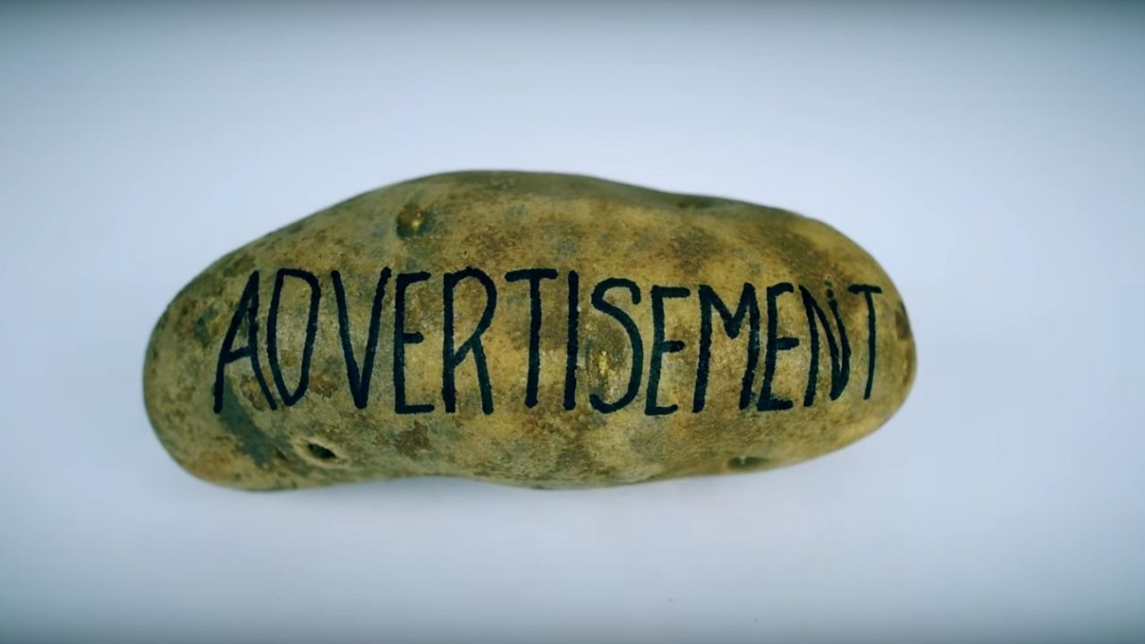 A potato with the word "advertisement"