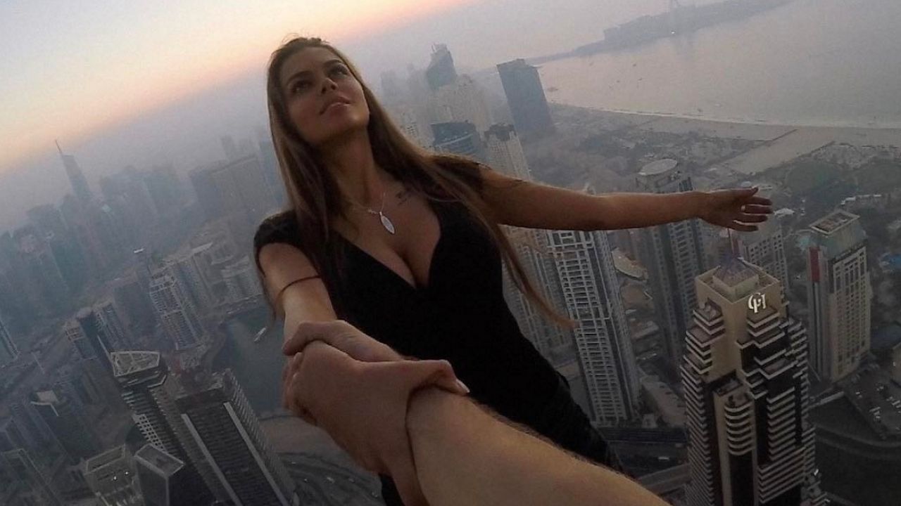 Viktoria Odintcova hangs from Cayan Tower in Dubai