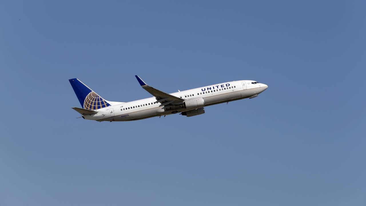 A United Airlines plane departs an airport.