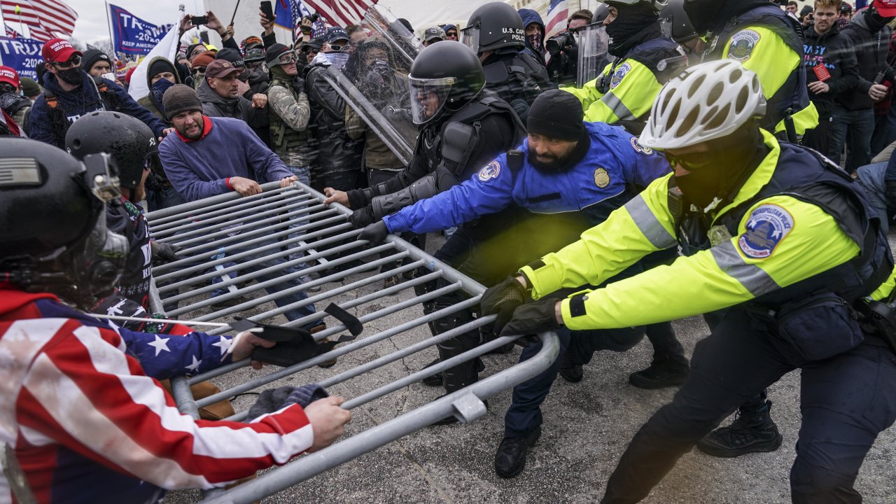 Trump supporters beset a police barrier at the Capitol in Washington during the Jan. 6 Capitol riot.