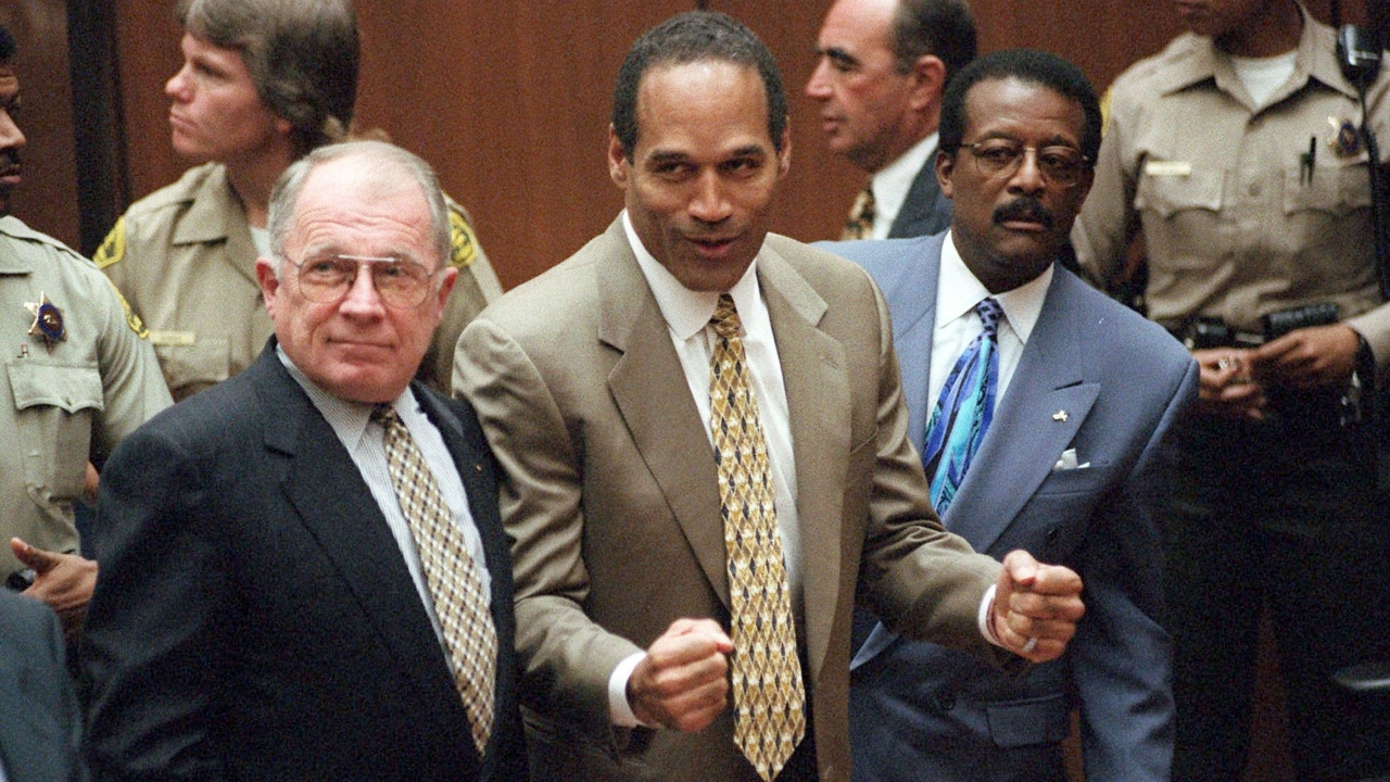 Oct. 3, 1995 file photo of F. Lee Bailey, O.J. Simpson and Johnnie Cochran.