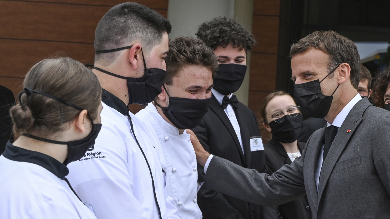 French President Emmanuel Macron talks with cooking students, Tuesday June 8, 2021.