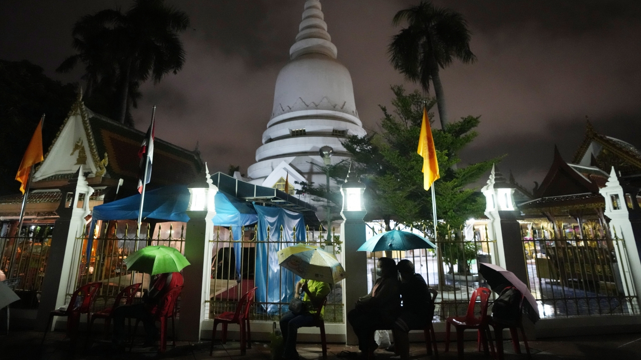 Locals wait in line overnight for free coronavirus testing at Wat Phra Si Mahathat temple in Bangkok