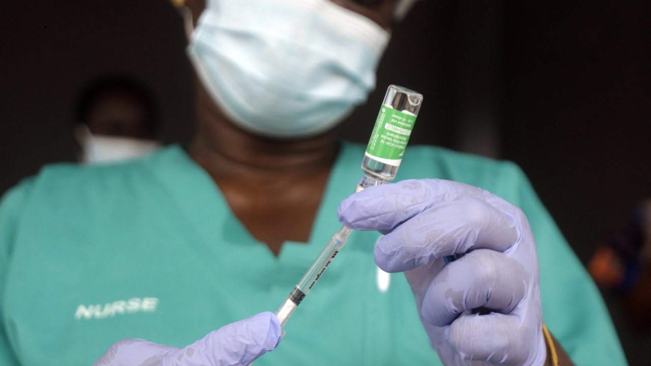 A nurse prepares one of the country's first coronavirus vaccinations,