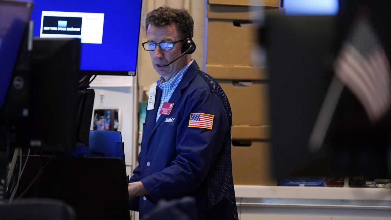 A trader works in his booth on the floor of the New York Stock Exchange