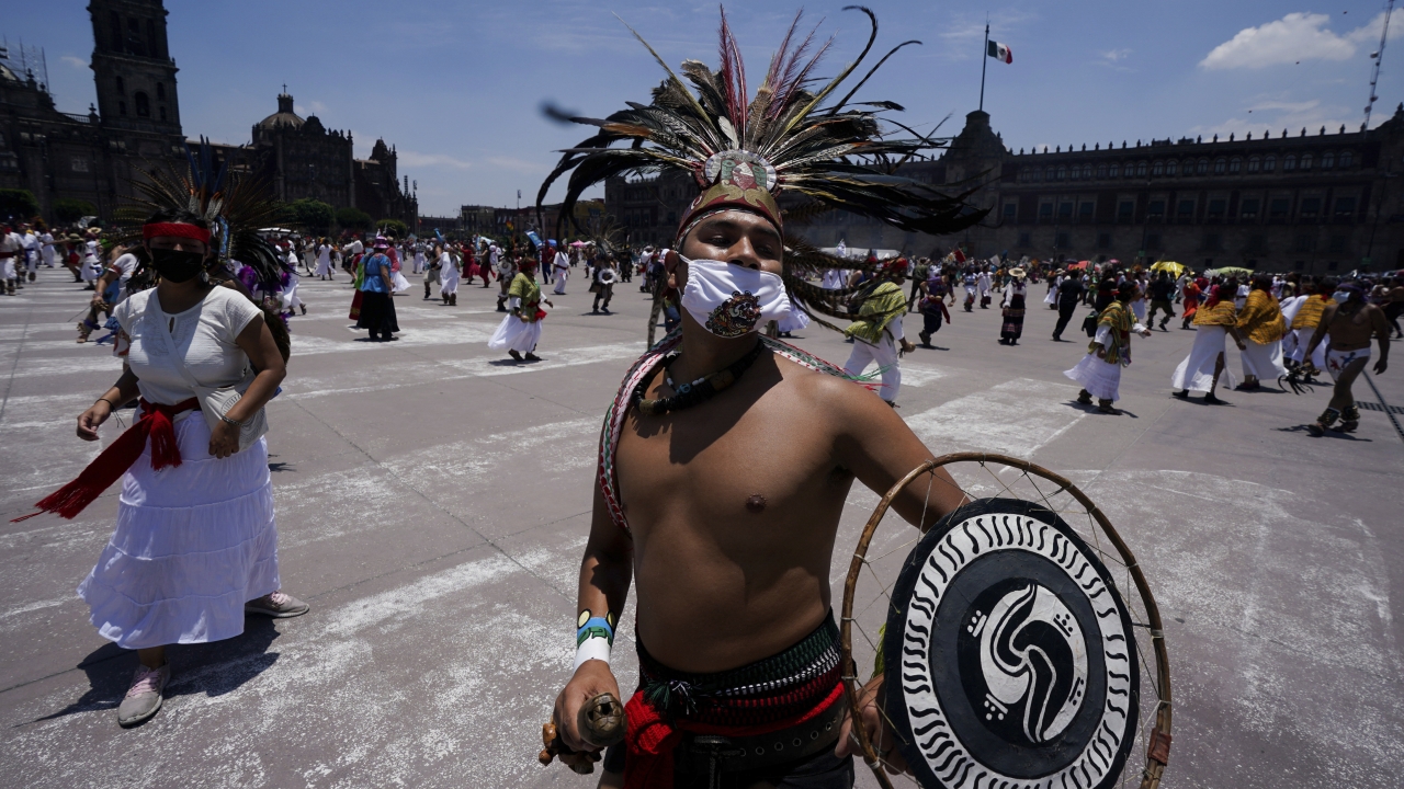 Mexican dancers perform during a ceremony marking the 700 year anniversary of the founding of the Aztec city of Tenochtitlan