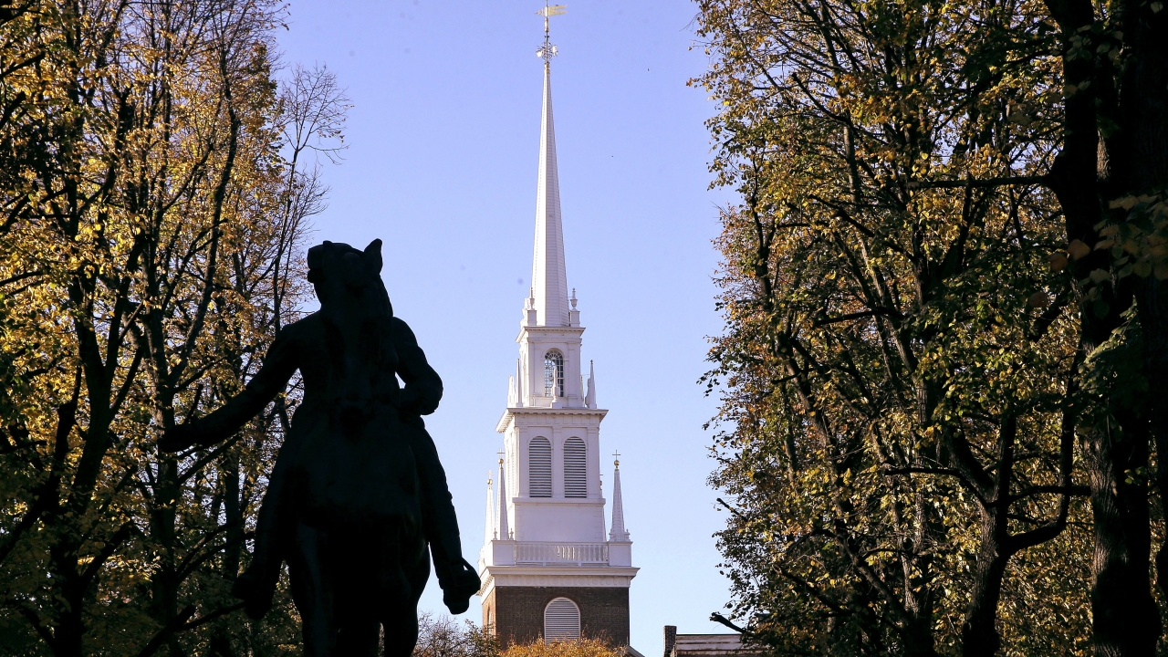 Tthe Old North Church stands behind a statue of Paul Revere in the North End neighborhood of Boston.