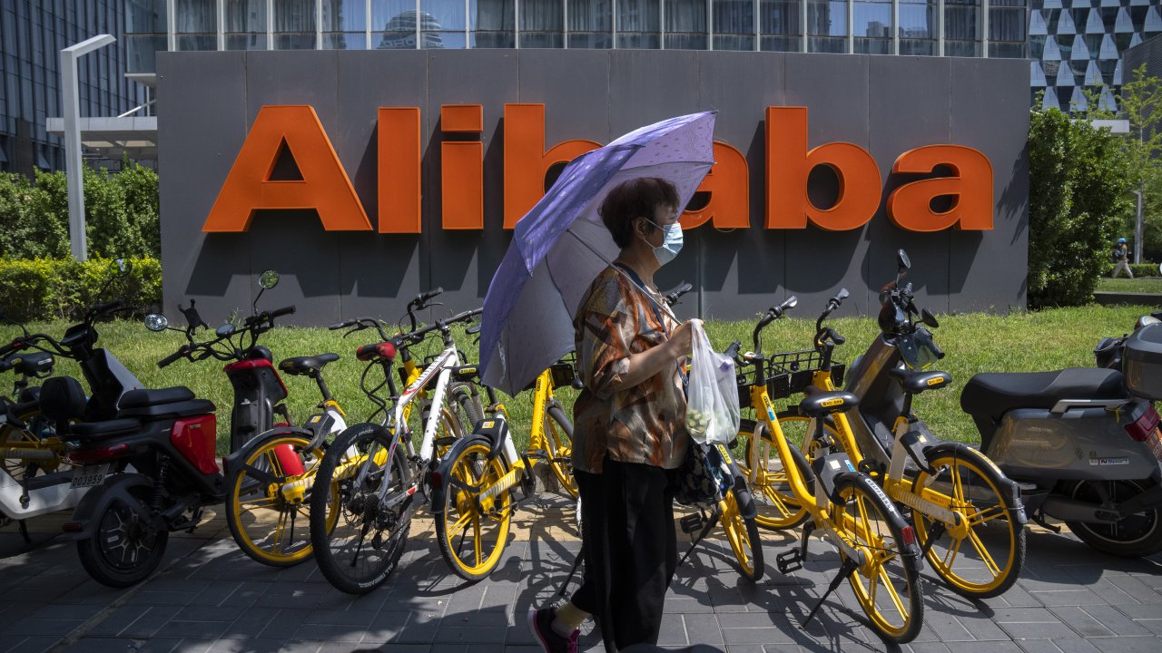 Woman near Alibaba sign