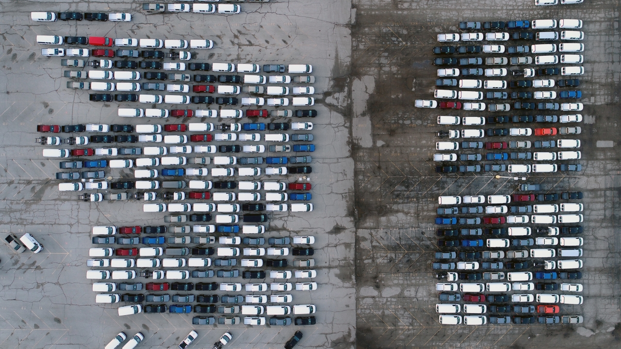 Cars parked outisde a General Motors assembly plant.