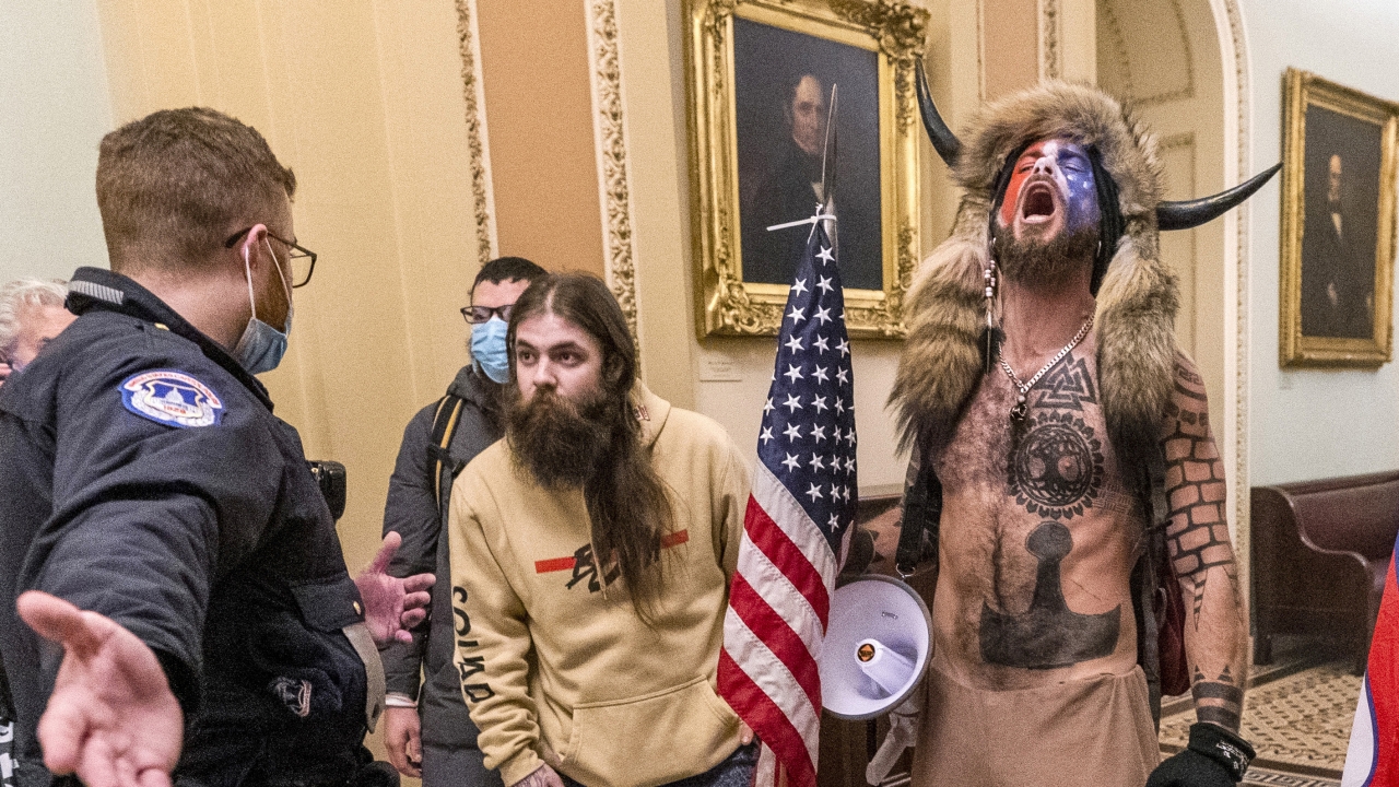 Jacob Chansley, right with fur hat, during the Capitol riot in Washington.