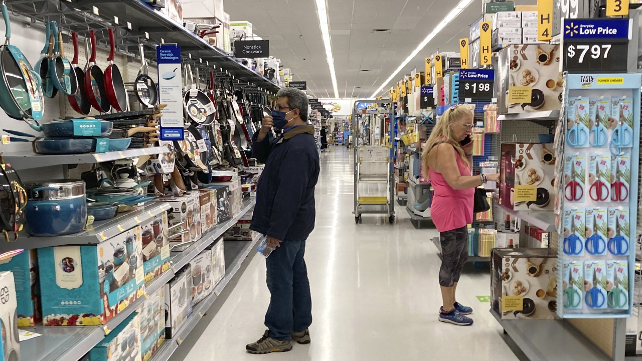 Consumers shop at a Walmart store in Vernon Hills, Ill., Sunday, May 23, 2021.