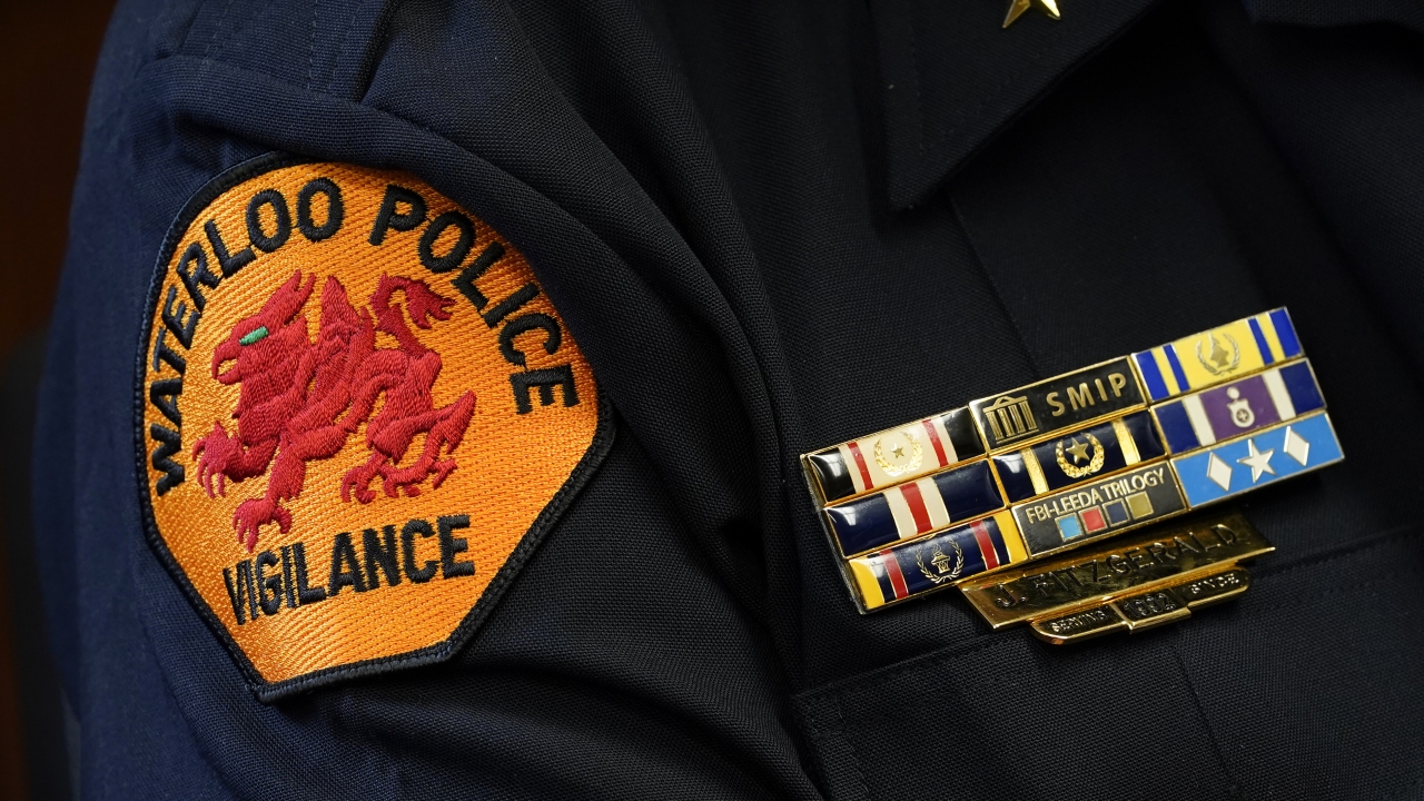 The Waterloo Police Dept. patch is seen on the arm of Chief Joel Fitzgerald