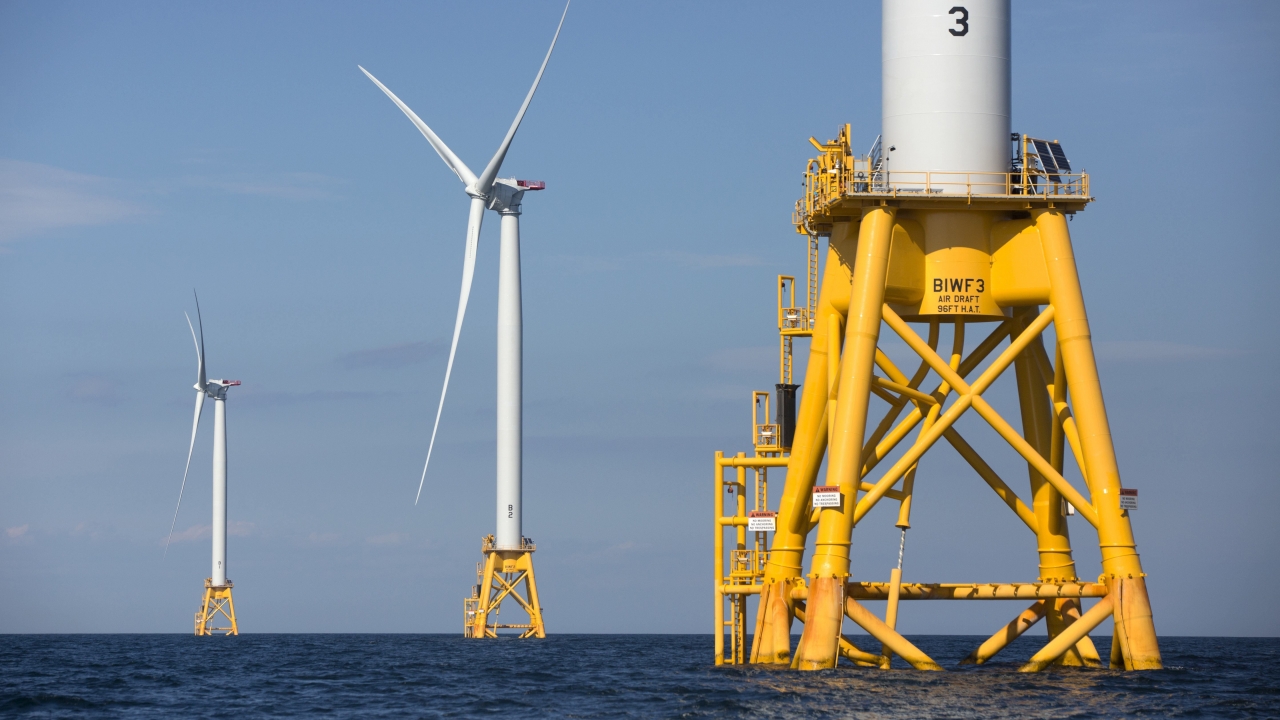 Wind turbines stand in the water
