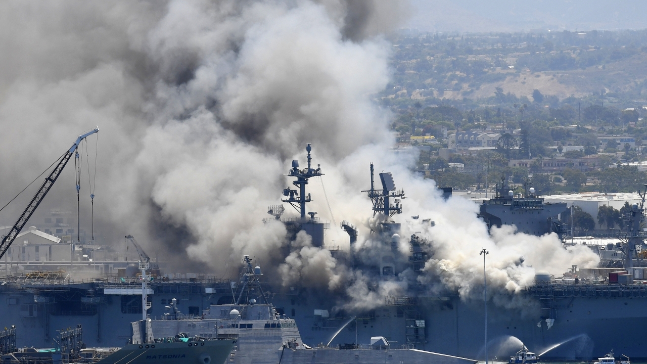 In this July 12, 2020, file photo, smoke rises from the USS Bonhomme Richard at Naval Base San Diego.