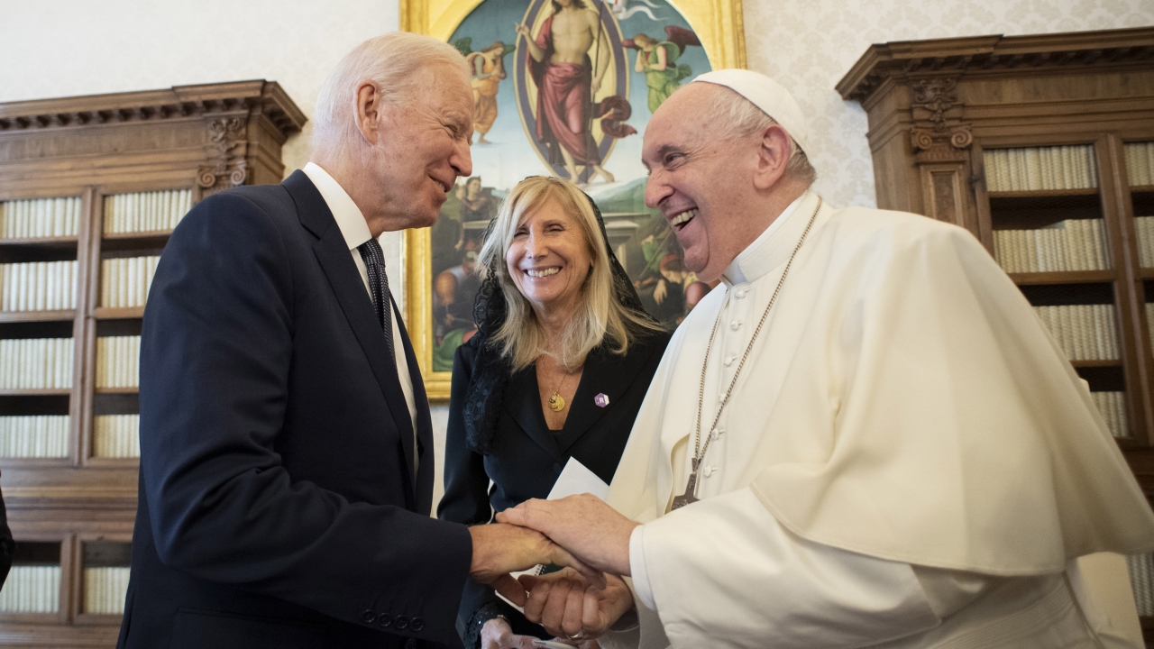 President Joe Biden shakes hands with Pope Francis