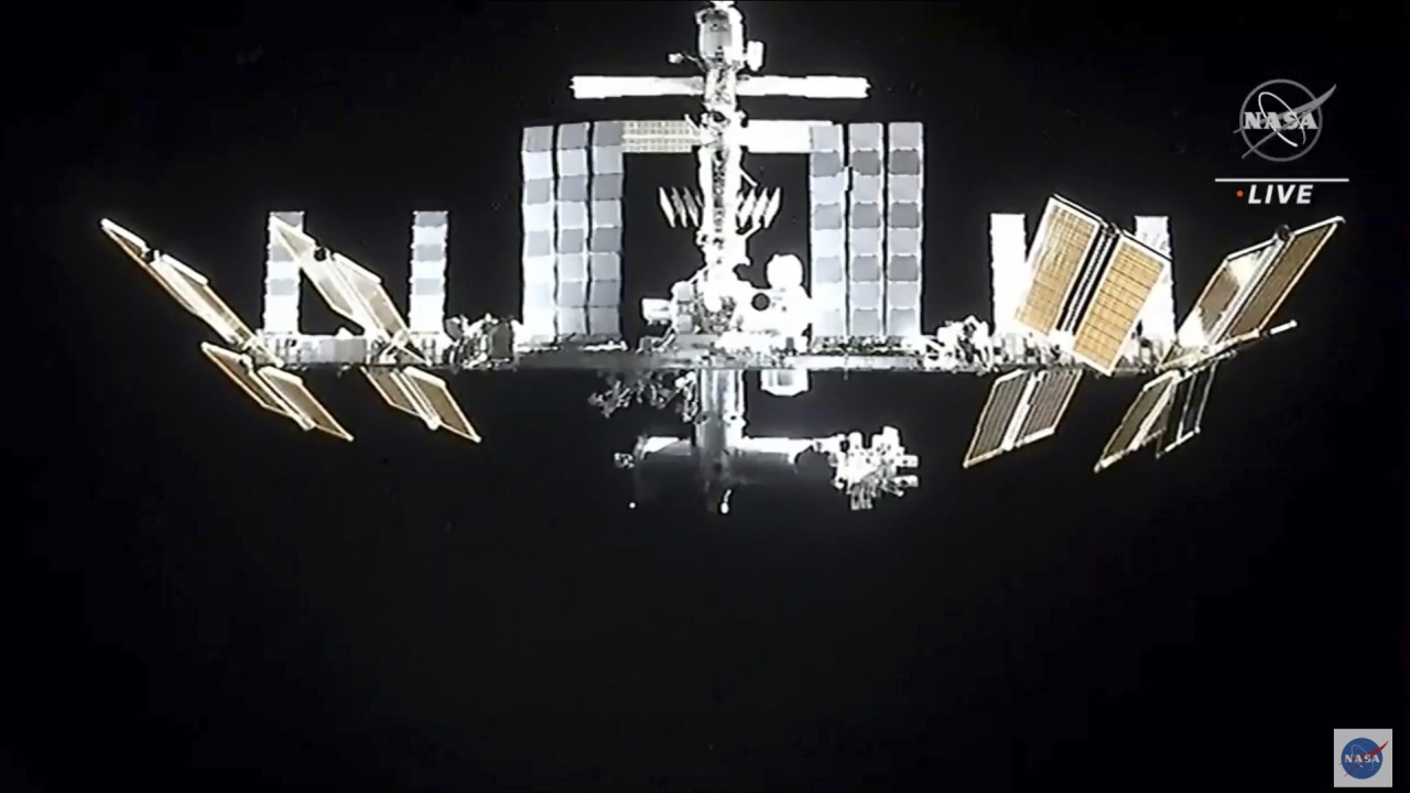 A photo of the International Space Station as the SpaceX Dragon capsule undocks.
