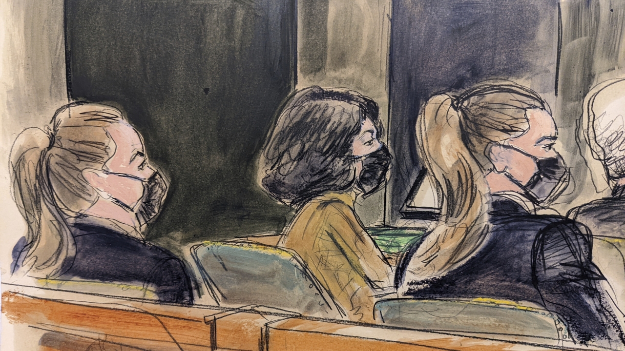 Ghislaine Maxwell seated in court between two U.S. Marshals