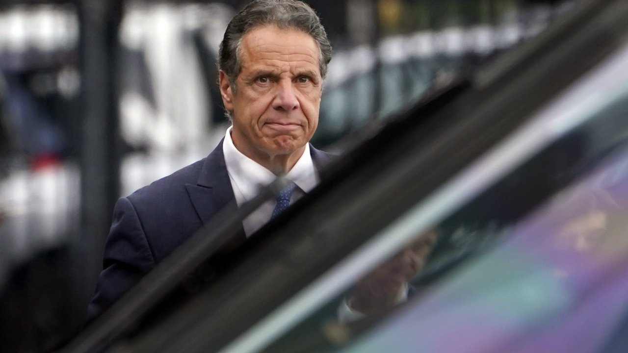 New York Gov. Andrew Cuomo prepares to board a helicopter after announcing his resignation
