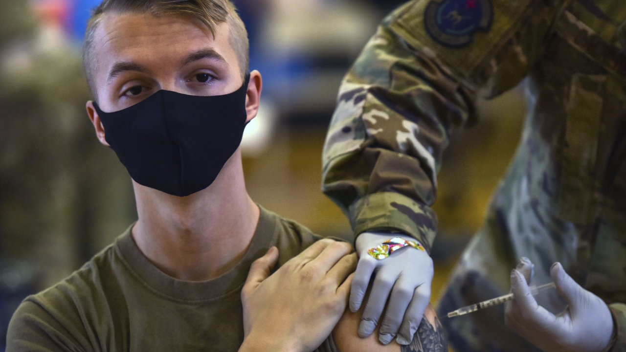 A military service member getting vaccinated.
