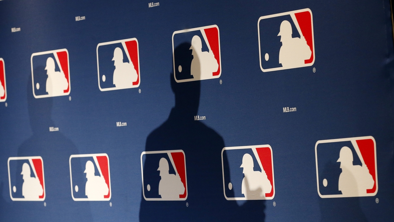 MLB logo backdrop.