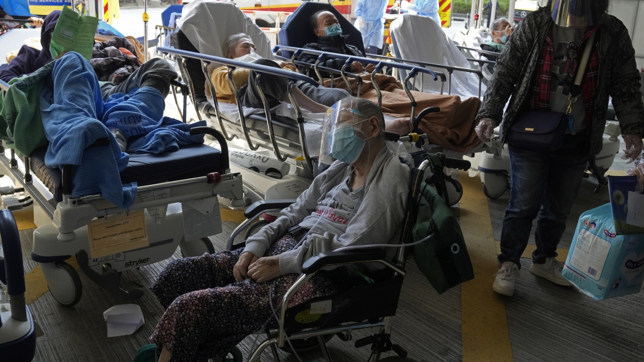 Patients wait at a temporary treatment area outside Caritas Medical Centre in Hong Kong