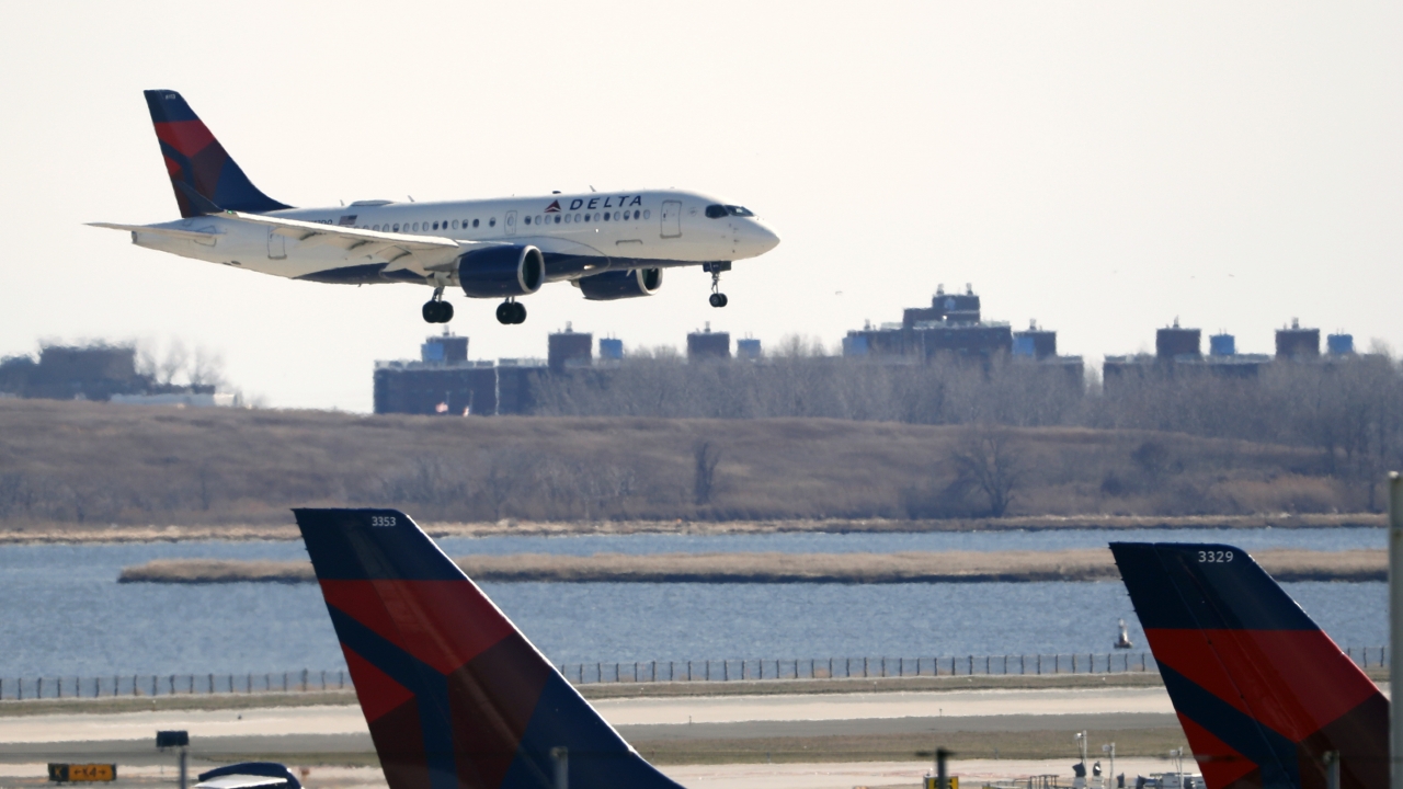A Delta Airlines jet lands at John F. Kennedy International Airport