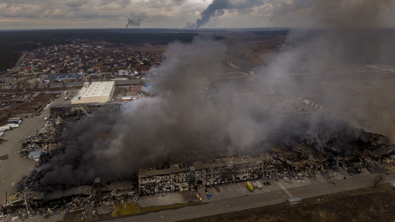 A factory and a store are burning after been bombarded in the outskirts of Kyiv, Ukraine.