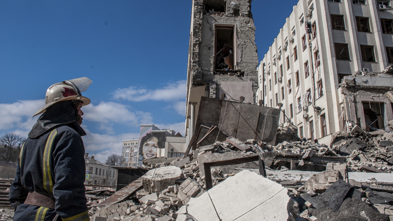 Rescuers work at the site of the National Academy of State Administration building damaged by shelling in Kharkiv, Ukraine