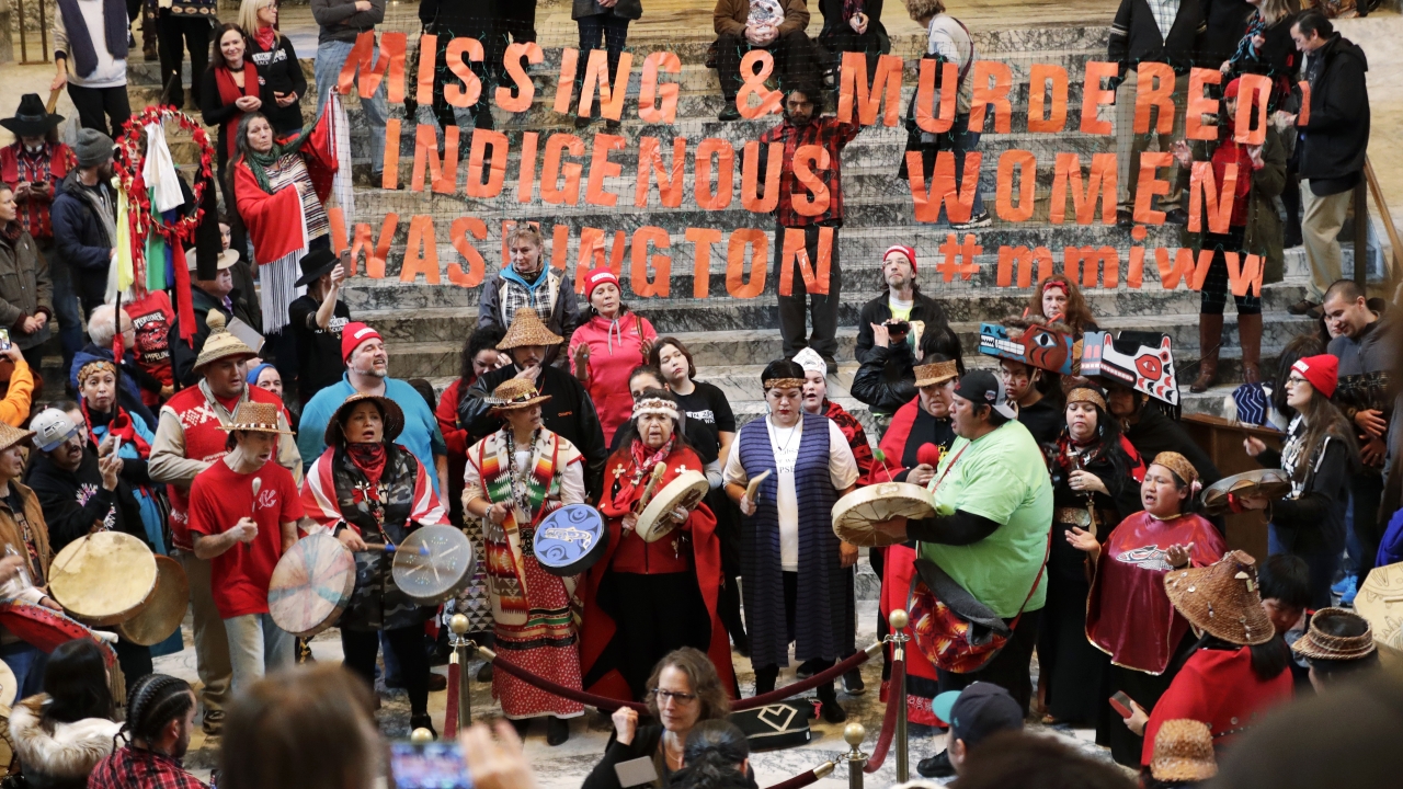 Native American tribal members calling out support for awareness of missing and murdered indigenous women.