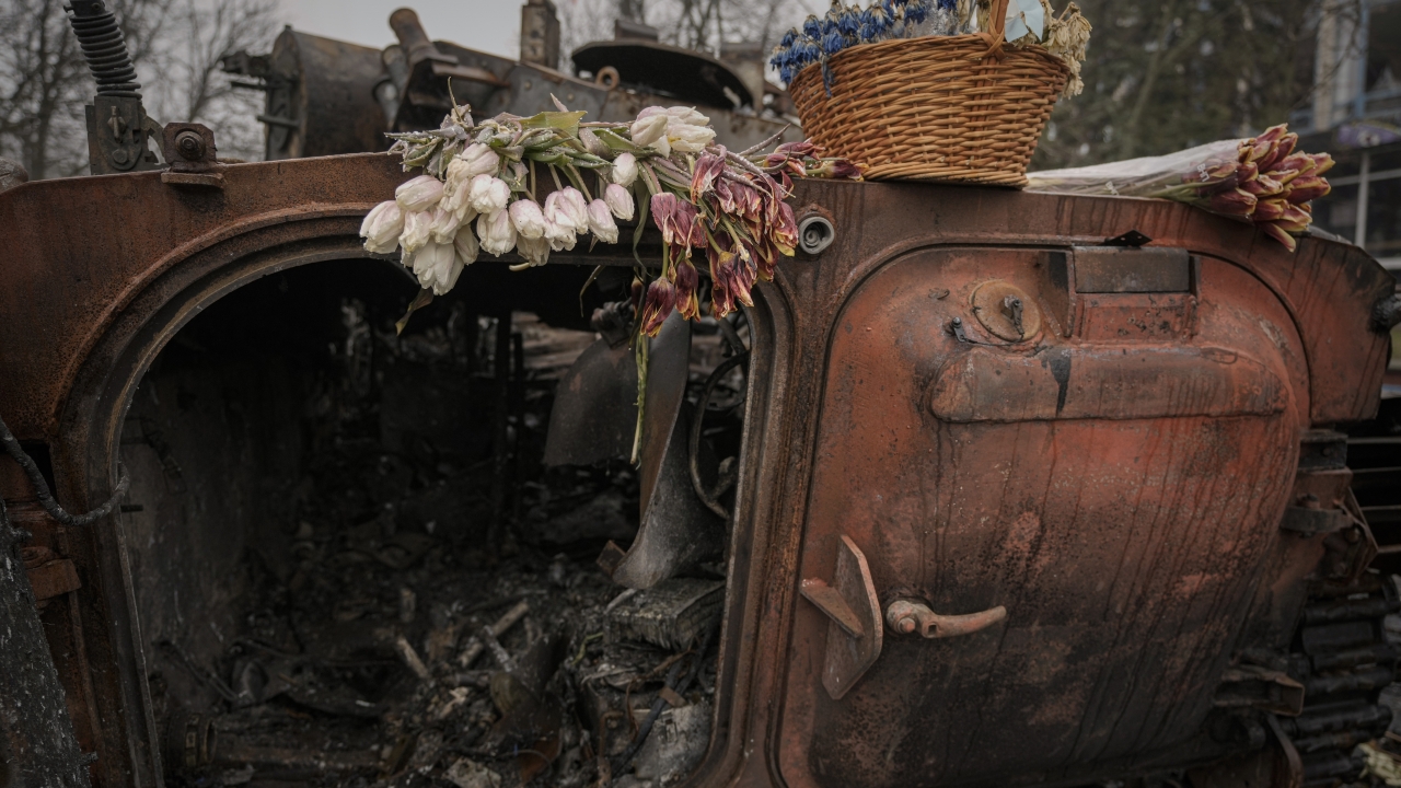 Flowers are placed on a destroyed Ukrainian military armored fighting vehicle.