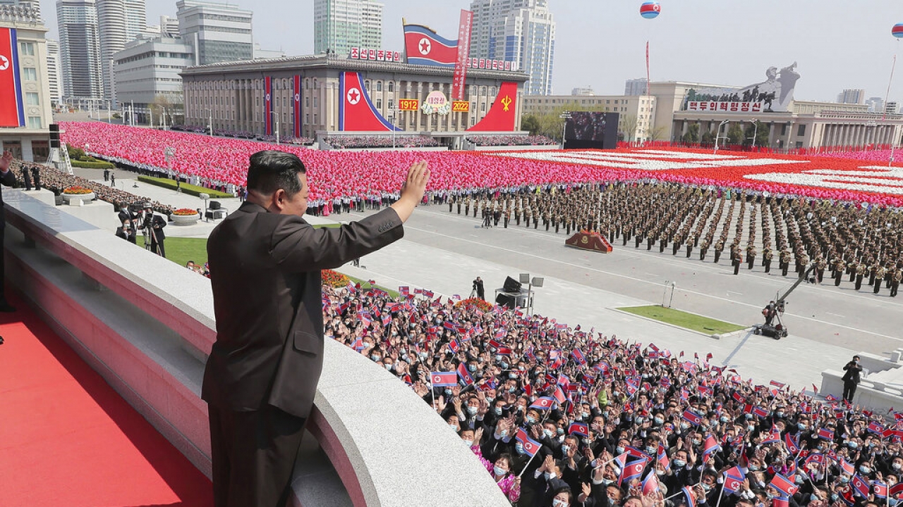 North Korean leader Kim Jong-un waves from balcony as he attends a parade to celebrate the 110th birth anniversary.