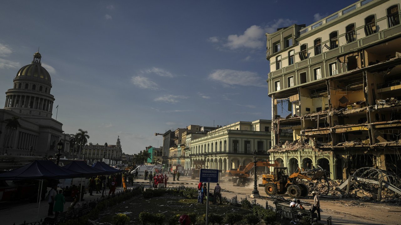 Rescue teams remove debris from the site of a deadly explosion that destroyed the five-star Hotel Saratoga, in Havana, Cuba