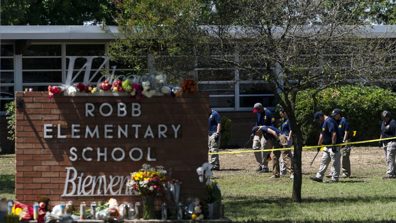 Investigators search for evidences outside Robb Elementary School in Uvalde, Texas.