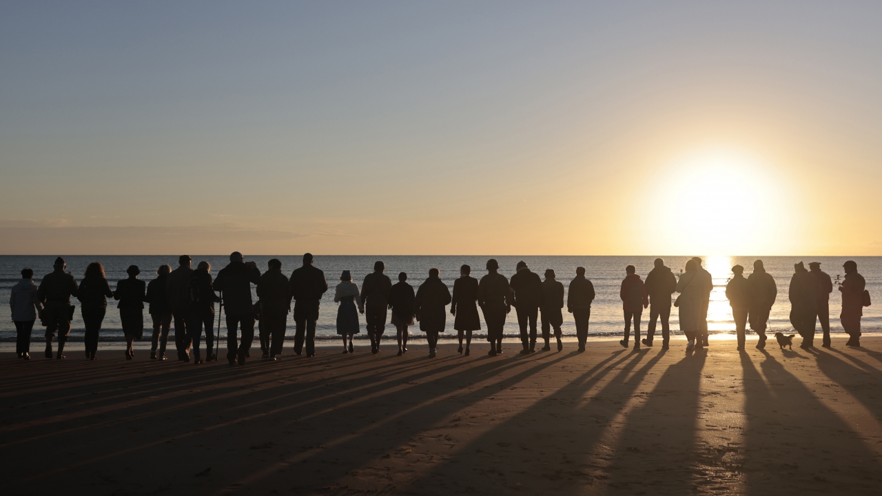 World War II reenactors gather on Omaha Beach in Saint-Laurent-sur-Mer, Normandy, France.