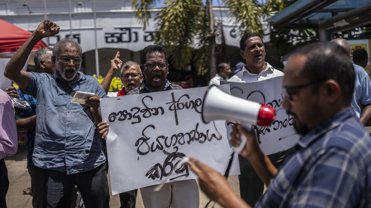 Trade union representatives and activists protest against Sri Lanka’s acting president Ranil Wickremesinghe