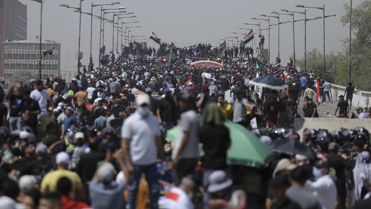 Protesters gather a bridge leading to the Green Zone area in Baghdad, Iraq.