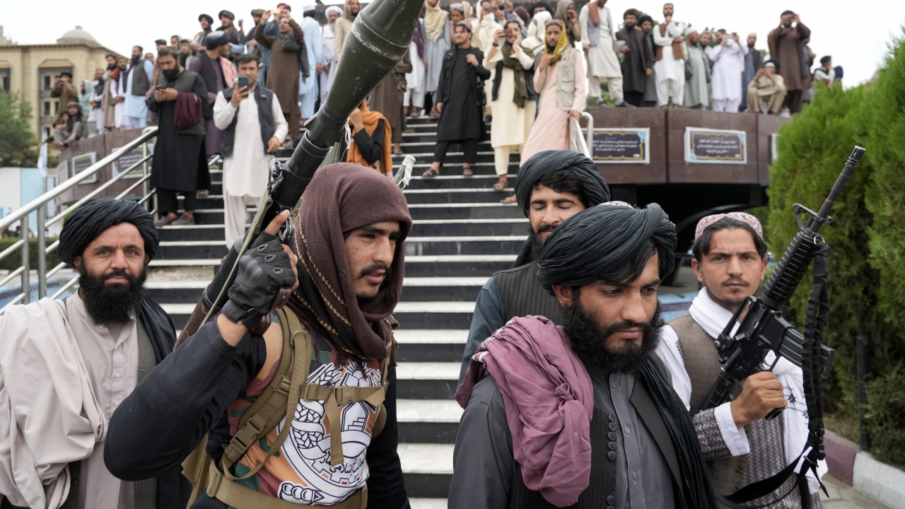 Taliban fighters celebrate one year since they seized the Afghan capital.