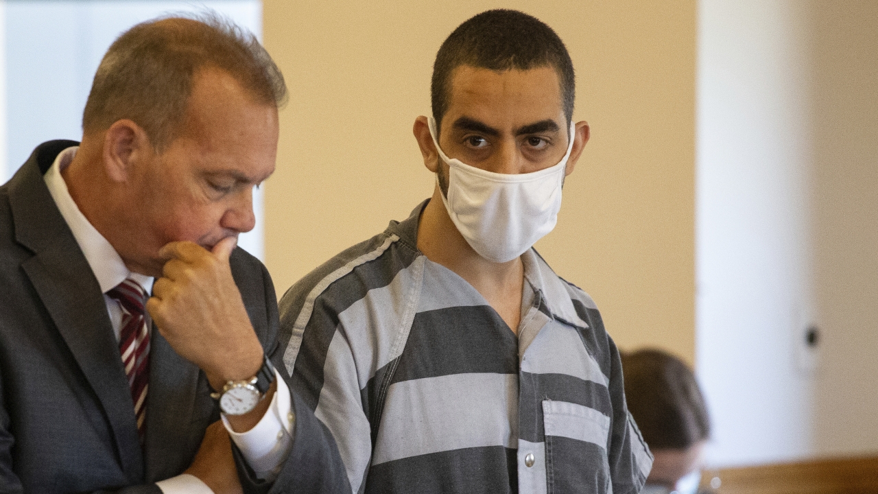 Defense attorney Nathaniel Barone, left, and Hadi Matar, 24, right, listen during an arraignment
