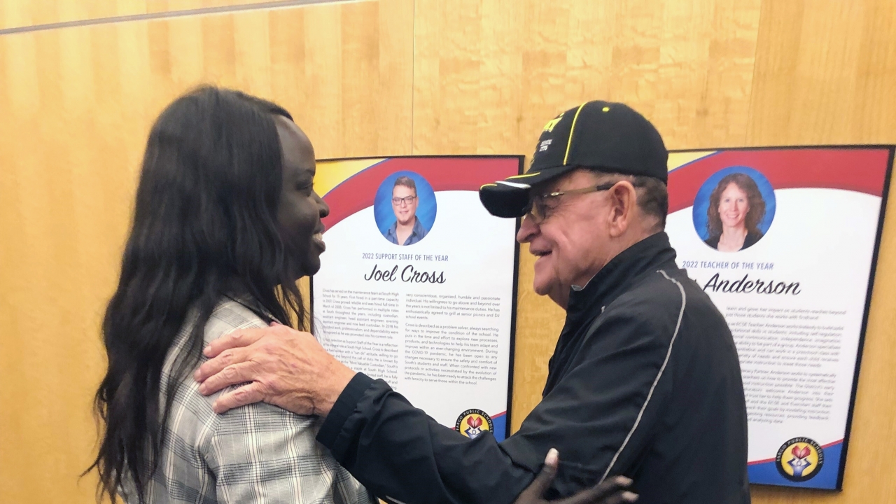 A school board member in Fargo, N.D., is greeted by Vietnam veteran following a special meeting