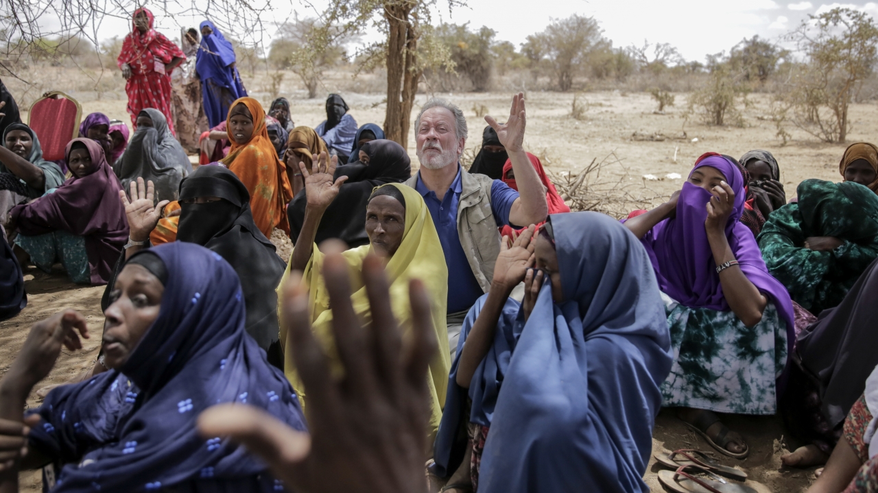World Food Program chief David Beasley meets with villagers in the village of Wagalla in northern Kenya