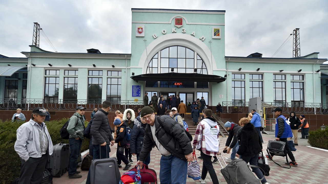 Evacuees from Kherson gather upon their arrival at the railway station in Dzhankoi, Crimea.