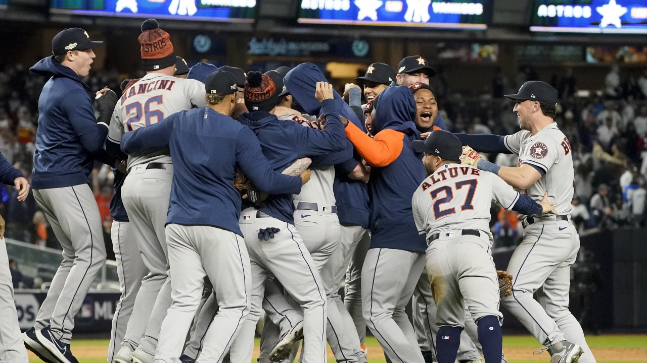 The Houston Astros celebrate after defeating the New York Yankees.