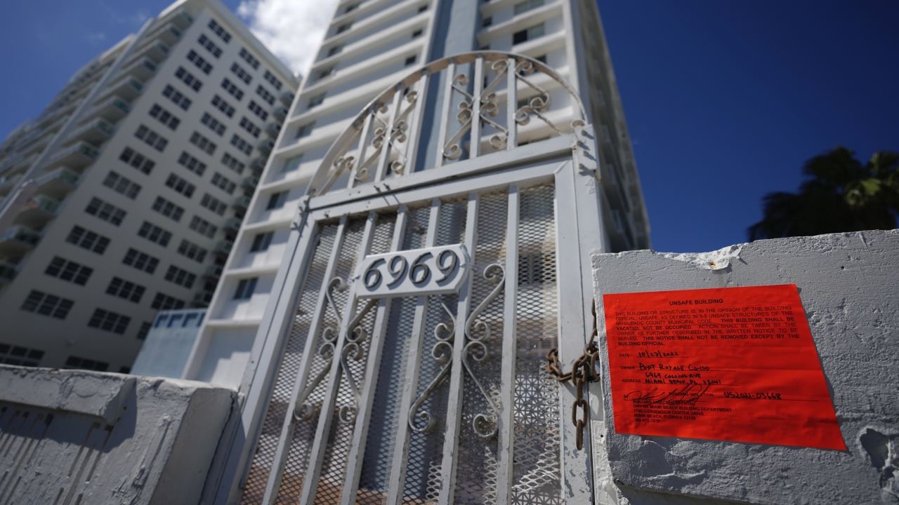 An unsafe building notice marks the chained off beach entrance to the Port Royale building.
