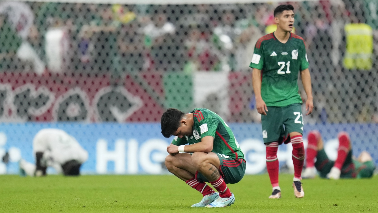 Players from Mexico's team on the field at the World Cup.