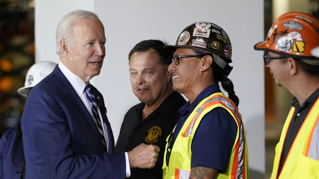 President Joe Biden tours the building site for a new computer chip plant for Taiwan Semiconductor Manufacturing Company