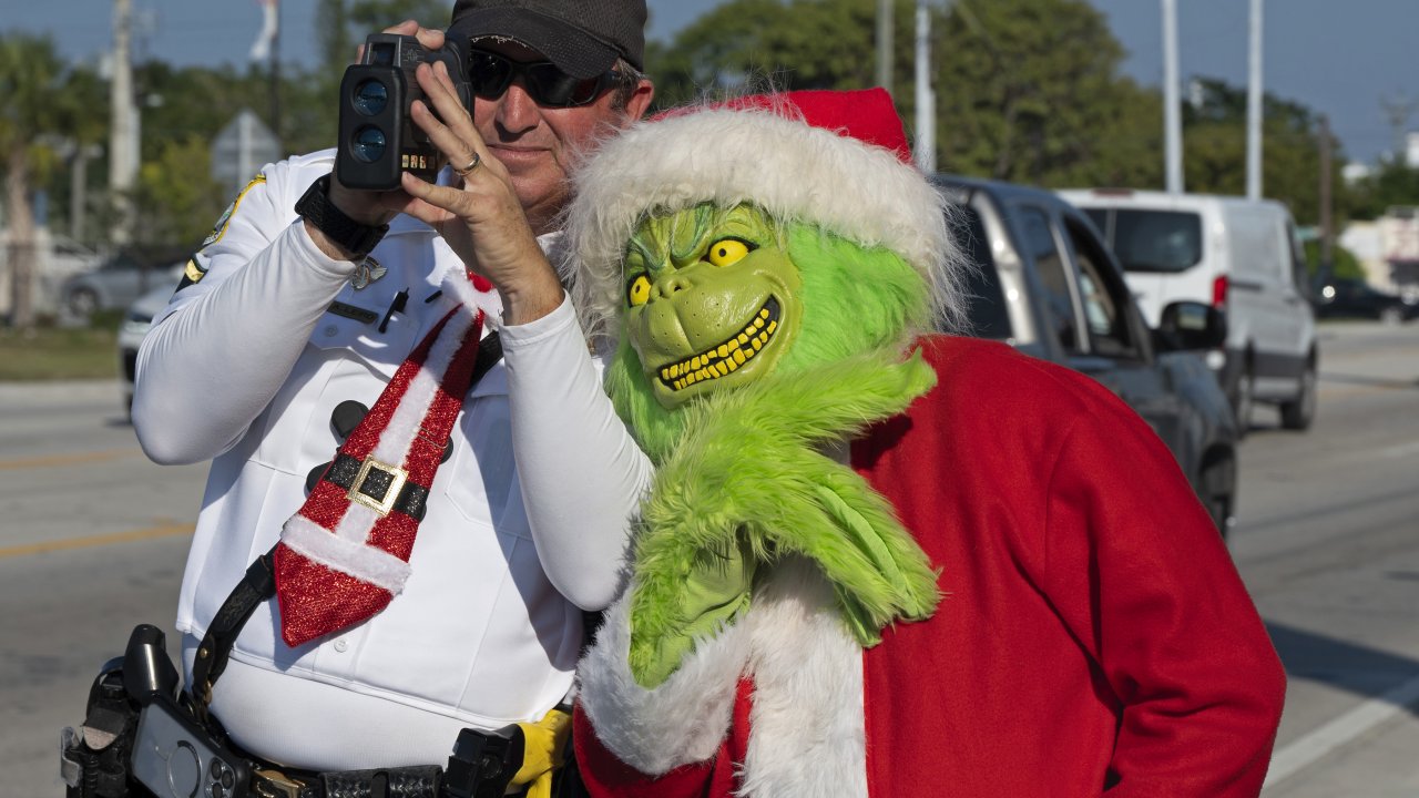 Monroe County Sheriff's Office Colonel Lou Caputo costumed as the Grinch.