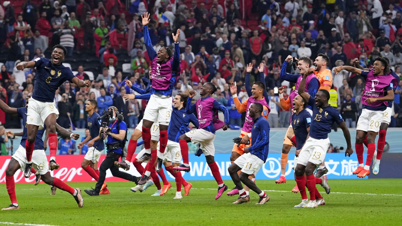 France players celebrate at the end of the World Cup semifinal soccer match.
